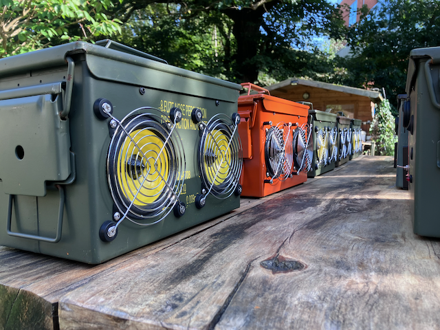 A row of ammo box speakers
